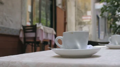 Coffe cup on a cafe table shot in f-log Stock Footage 169471188