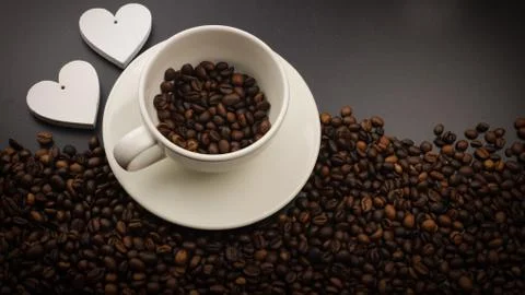 Coffe cup with coffee beans Stock Photos