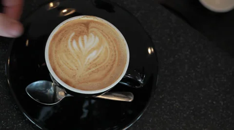 Coffe cup sliding in Video stock 33846875