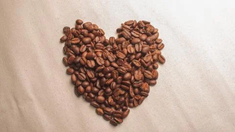 Coffe grains pile on the table Stock Photos