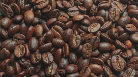 Coffe grains pile on the table Stock Photos