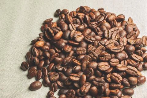 Coffe grains pile on the table Stock Photos