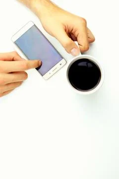 Coffe with mobile on white background Stock Photos