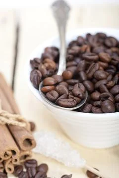 Coffe sugar and spice on silver spoon over white wood rustic table, food Stock Photos