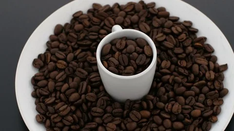 Coffebeans and Cup spinning on Turntable Stock Footage 75751045