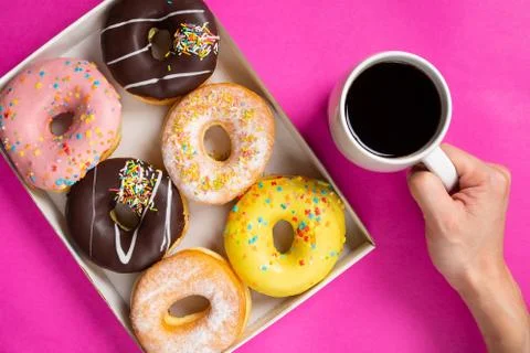 Coffee and appetizing doughnuts. Stock Photos