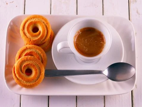 Coffee and biscuits Stock Photos