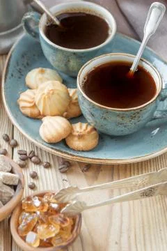Coffee and biscuits Stock Photos