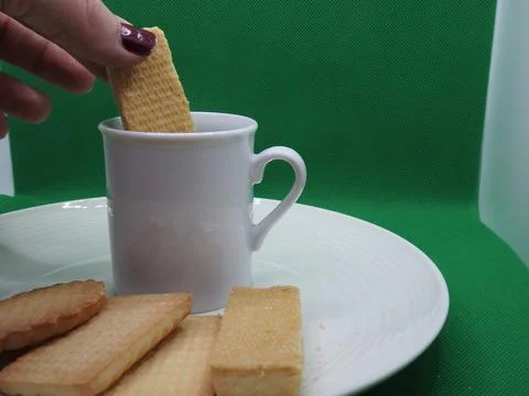 Coffee and biscuits Stock Photos