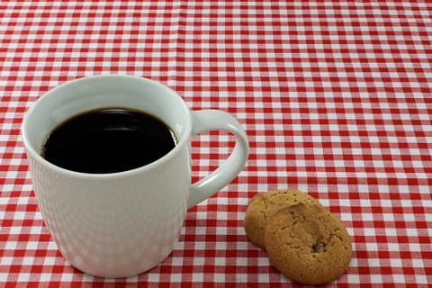 Coffee and biscuits on a tablecloth Stock Photos