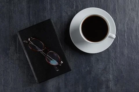 Coffee and book on the table Stock Photos
