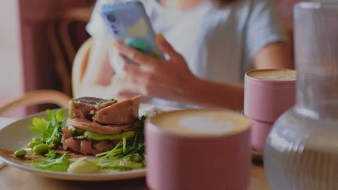 Coffee and a breakfast is on the table. Avocado and green veggie food. Video stock 245350405