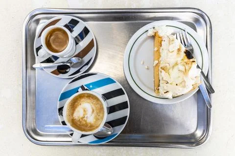 Coffee and cake served on a tray in a Portuguese caf Stock Photos