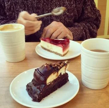 Coffee and cake on table Stock Photos