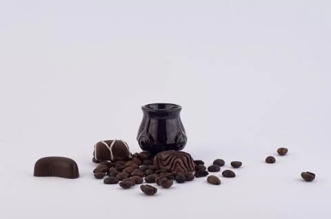 Coffee and chocolates Stock Photos