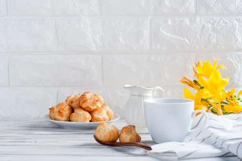 Coffee and eclairs on a white background Stock Photos