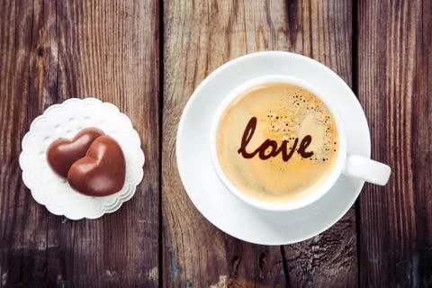 Coffee and heart chocolates Stock Photos