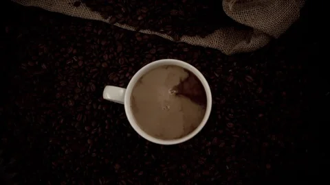 Coffee and milk blending in slow motion Stock Footage 76100743