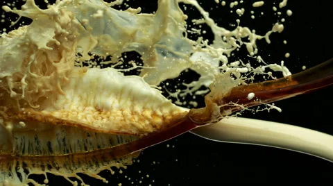 Coffee and milk collision splash in midair, Slow Motion Video stock 42079846