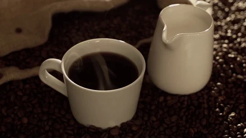 Coffee and milk in slow motion Stock Footage 76100239
