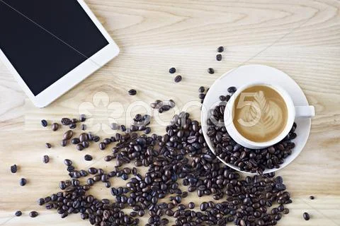 Coffee and mini tablet Stock Photos
