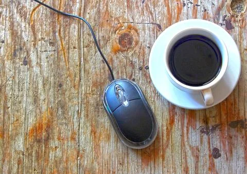 Coffee and mouse on the table Stock Photos