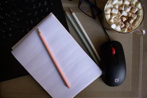Coffee and notebook on the desktop Stock Photos