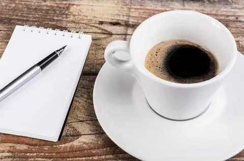 Coffee and notepad Stock Photos