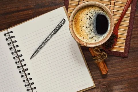 Coffee and opened notebook in horizontal top view Stock Photos