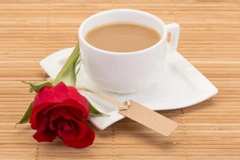 Coffee and rose on table Stock Photos