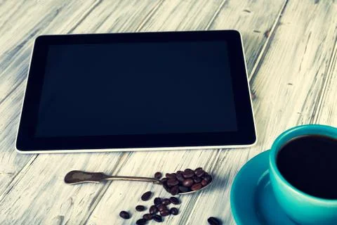 Coffee and tablet on the table Foto stock