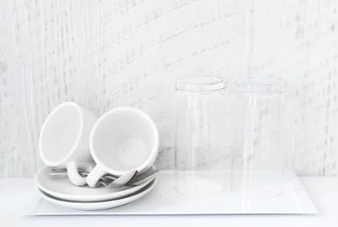 Coffee and tea making set of white cups, saucers, tea spoons and glasses on Stock Photos