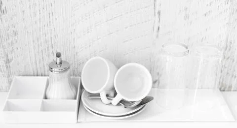 Coffee and tea making set of white cups, saucers, tea spoons and glasses on Stock Photos