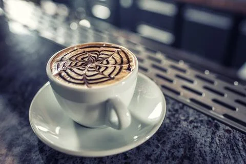 Coffee art artistic pattern on latte or cappuccino Stock Photos