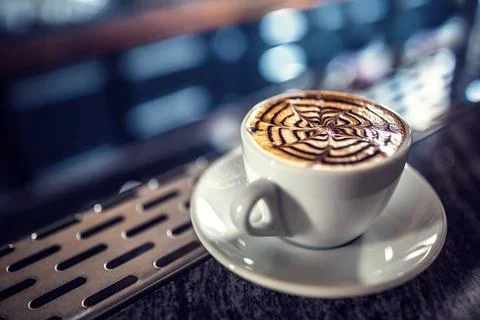 Coffee art artistic pattern on latte or cappuccino Stock Photos