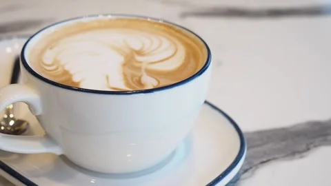 Coffee art creation in a cozy cafe during afternoon hours Stock Footage 328002334