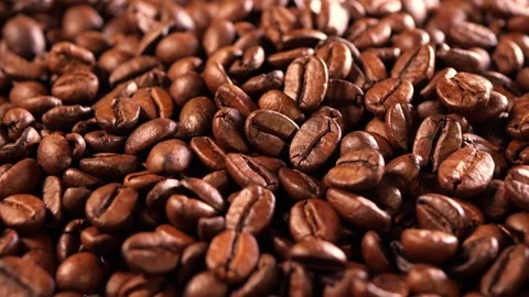 Coffee background. close up of roasted coffee beans with zoom in motion Video stock 257310370