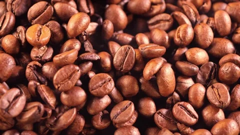 Coffee background. close up of roasted coffee beans with smoke rising and zoom Stock Footage 258805365