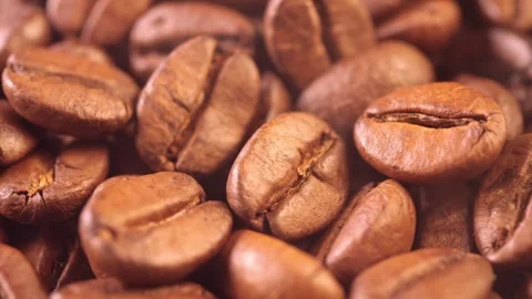 Coffee background. close up of roasted coffee beans with smoke rising and zoom Stock Footage 259753871