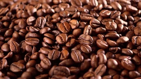 Coffee background. close up of roasted coffee beans with with light reflections 動画素材 265257063