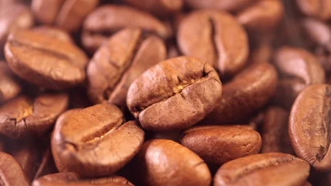Coffee background. close up of roasted coffee beans with smoke rising and zoom Stock Footage 282208928