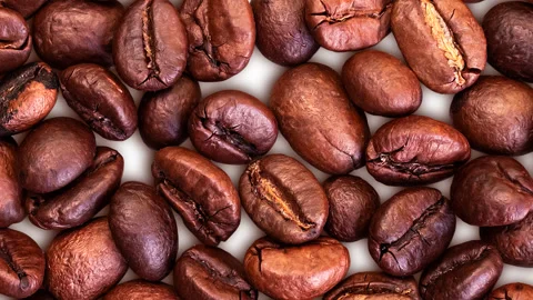 Coffee background. Close-up of whole roasted coffee beans. Stock Footage 304623834