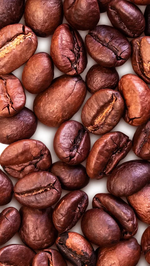 Coffee background. Close-up of whole roasted coffee beans. Stock Footage 304654791
