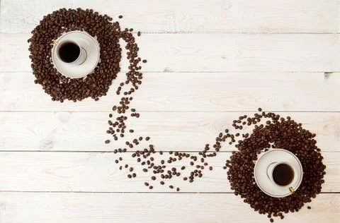 Coffee background. Coffee beans in circle shape with cup of coffee Stock Photos