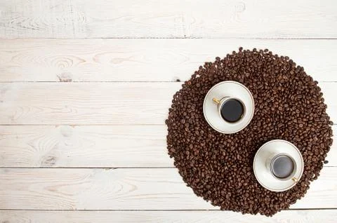 Coffee background. Coffee beans in circle shape with cup of coffee Stock Photos