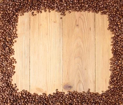 Coffee background. Coffee beans spread on table on four sides. Stock-Fotos
