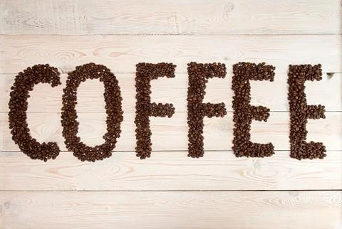Coffee background. Coffee beans with text coffee Stock Photos