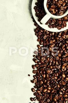 Coffee background, roasted coffee beans in a white cup, top view Stock Photos