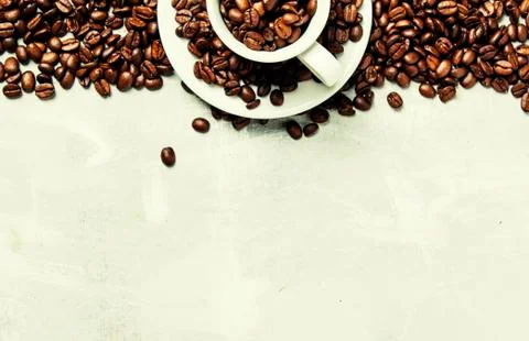 Coffee background, roasted coffee beans in a white cup, top view Stock Photos