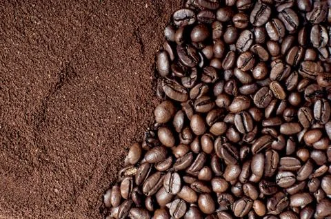 Coffee background texture. Ground coffee and coffee beans. Brown background. Fotos Stock